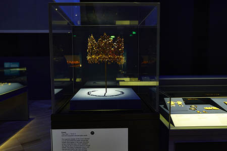 Display case featuring callapsible nomadic crown made of gold and turquoise coloured glass paste, found in Tomb Vi at Tillya Tepe