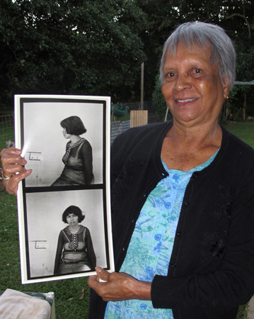 Jean Mosby with photographs of her mother taken during the Tindale expedition in 1938. Aloomba, North Queensland, 2012