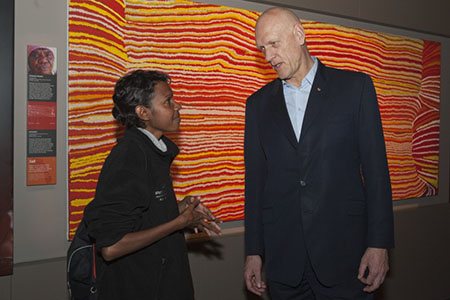 Standing in front of Kumpaya Girgaba’s massive Kaninjaku canvas are co-curator Hayley Atkins with Minister for the Environment, Heritage and the Arts, Peter Garrett, at the exhibition launch, July 2010