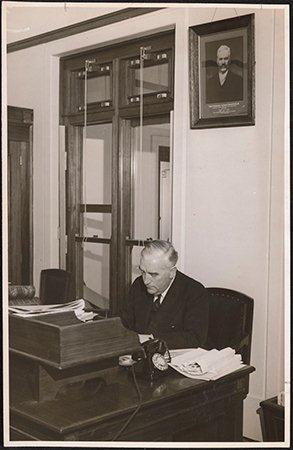Menzies working at a desk used by every prime minister from Stanley Melbourne Bruce to Gough Whitlam, and later John Howard