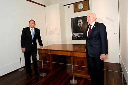 Prime Minister Tony Abbott (left) and former prime minister and guest curator John Howard at the exhibition’s launch