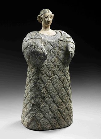 A figurine depicting a woman.