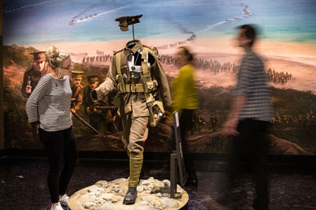 Visitors examine the cut-through model of soldiers’ kit