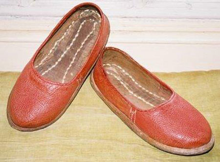 The ‘red slippers’ donated by a member of the Altounyan family to replace the original slippers that figure prominently in the story of the creation of the novel Swallows and Amazons and which symbolise the breach between Ransome and the Altounyans