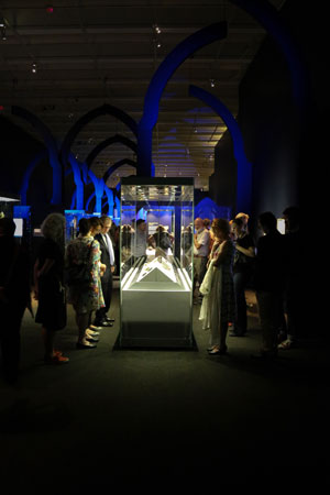 Gothic-style archways give context to the objects on display