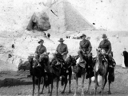 Privates WA Fisher, H Mahaffey, C Wright and C McLellan from the 9th Battalion enjoying a camel ride near the Pyramids, Egypt, December 1914