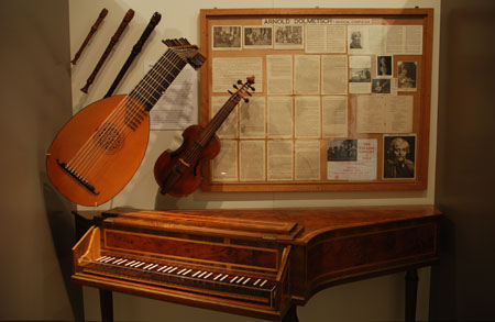 A display of instruments in the Grainger Museum featuring one of Grainger's original 'legends'