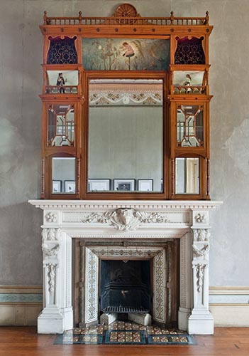 Detail of the drawing room at Villa Alba showing the coved overmantel made by WH Rocke & Co., with painted panels by Paterson Brothers, manufactured in 1884