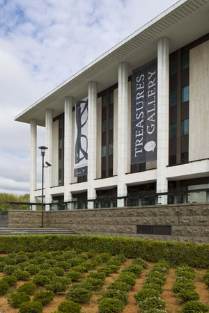 Patrick White’s glasses loom large over the entrance to the National Library of Australia, 2012