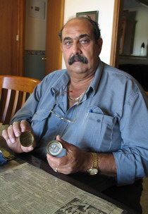 William Bejah holding brass compass